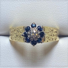 Load image into Gallery viewer, Secondhand 18ct Gold Sapphire and Diamond Cluster Ring with Bark Effect Shoulders
